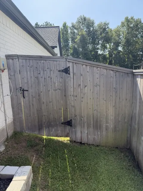 Weathered wooden gate before WOLF restoration