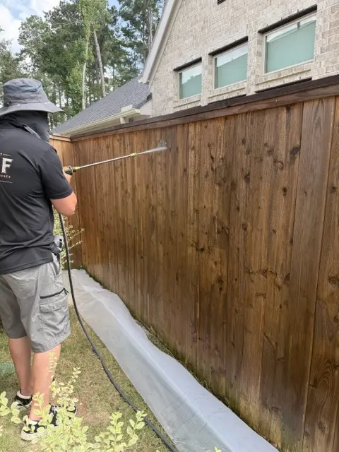 WOLF technician working along fence line