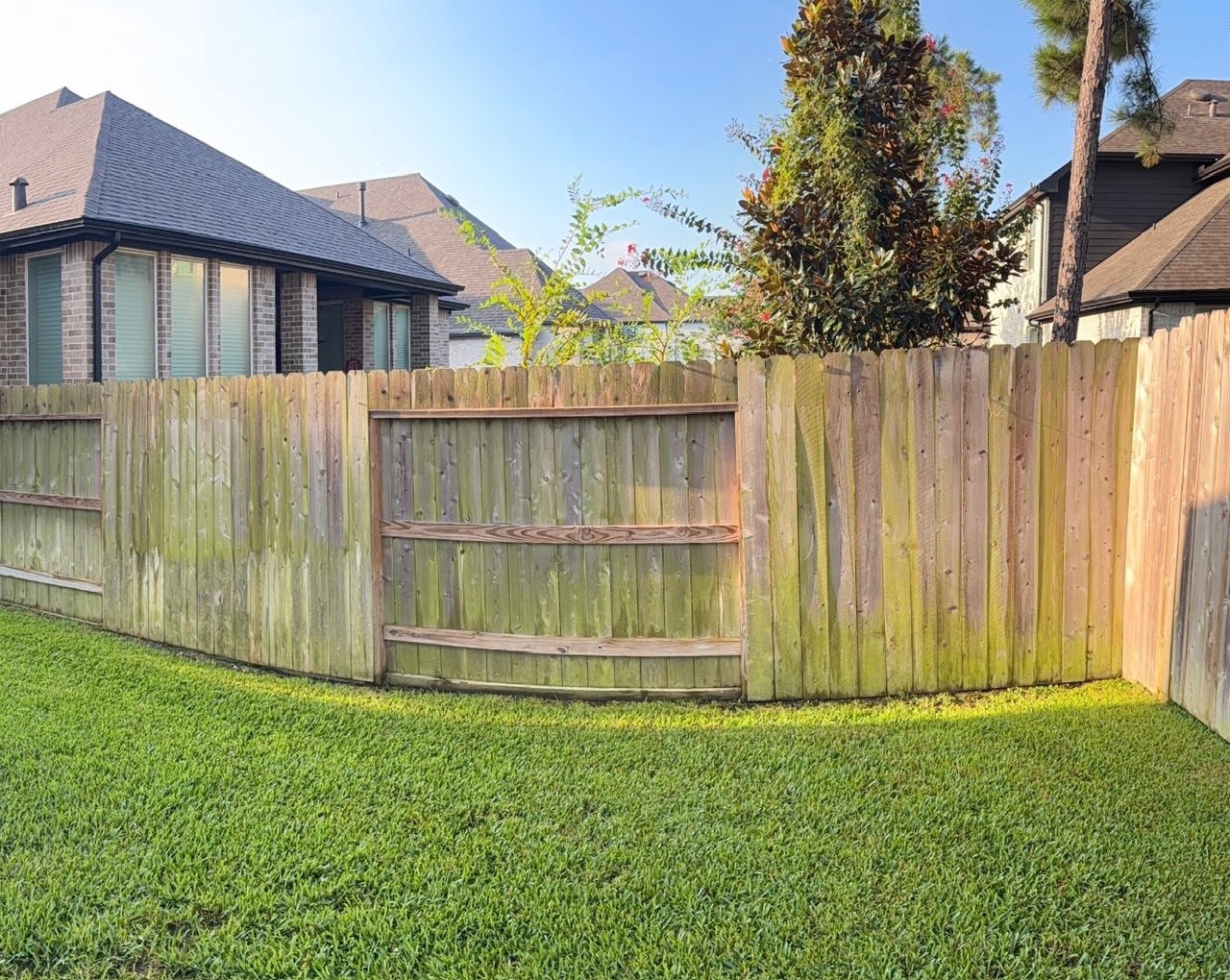 Weathered Woodforest fence before restoration and staining